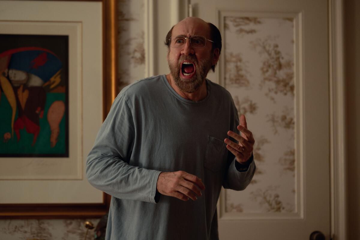 A bald Nicolas Cage screams in a scene from "Dream scenario."