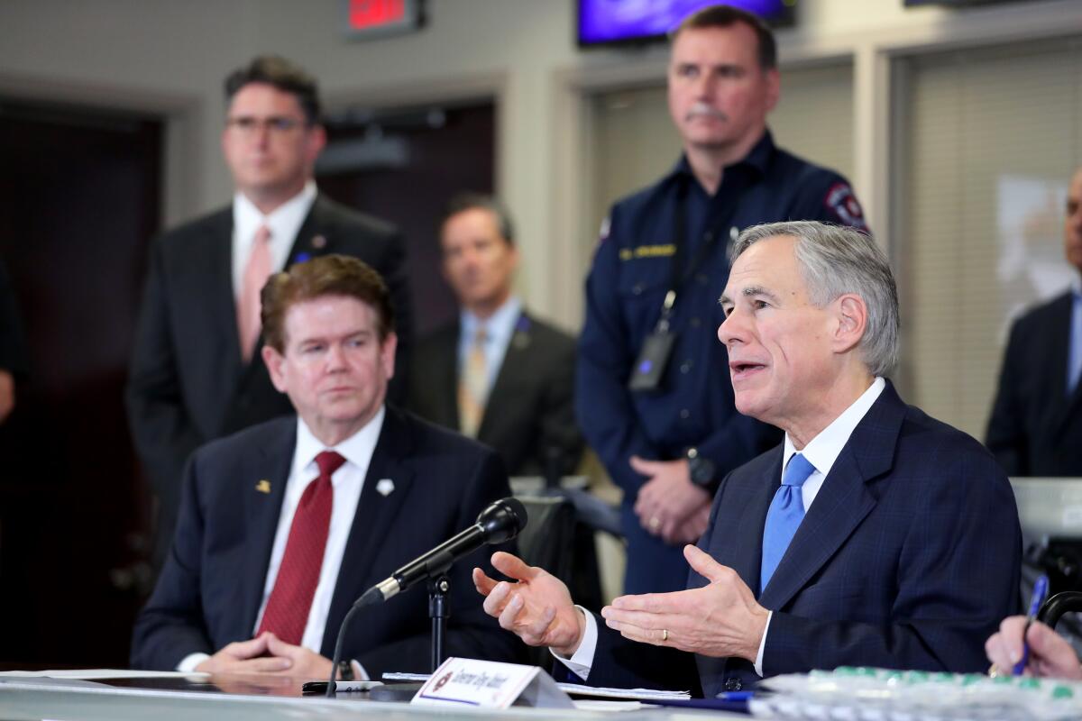 Texas Gov. Greg Abbott speaks to the media in Arlington on March 18.