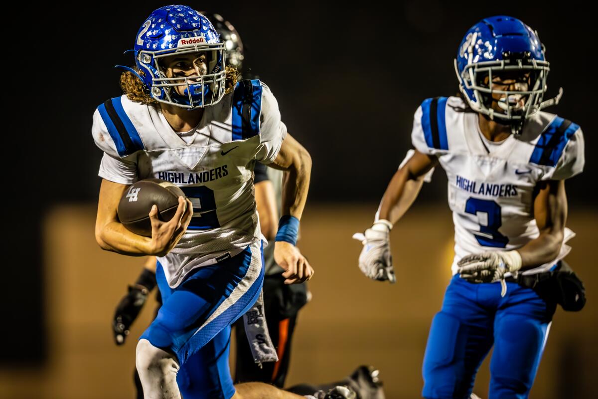 La Habra's Kenny Saucedo rushes for a big gain against Huntington Beach on Friday in an Epsilon League game.