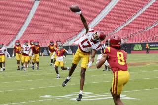 USC cornerback DeCarlos Nicholson, #17, deflects a pass to USC wide receiver Ja'Kobi Lane, #8,