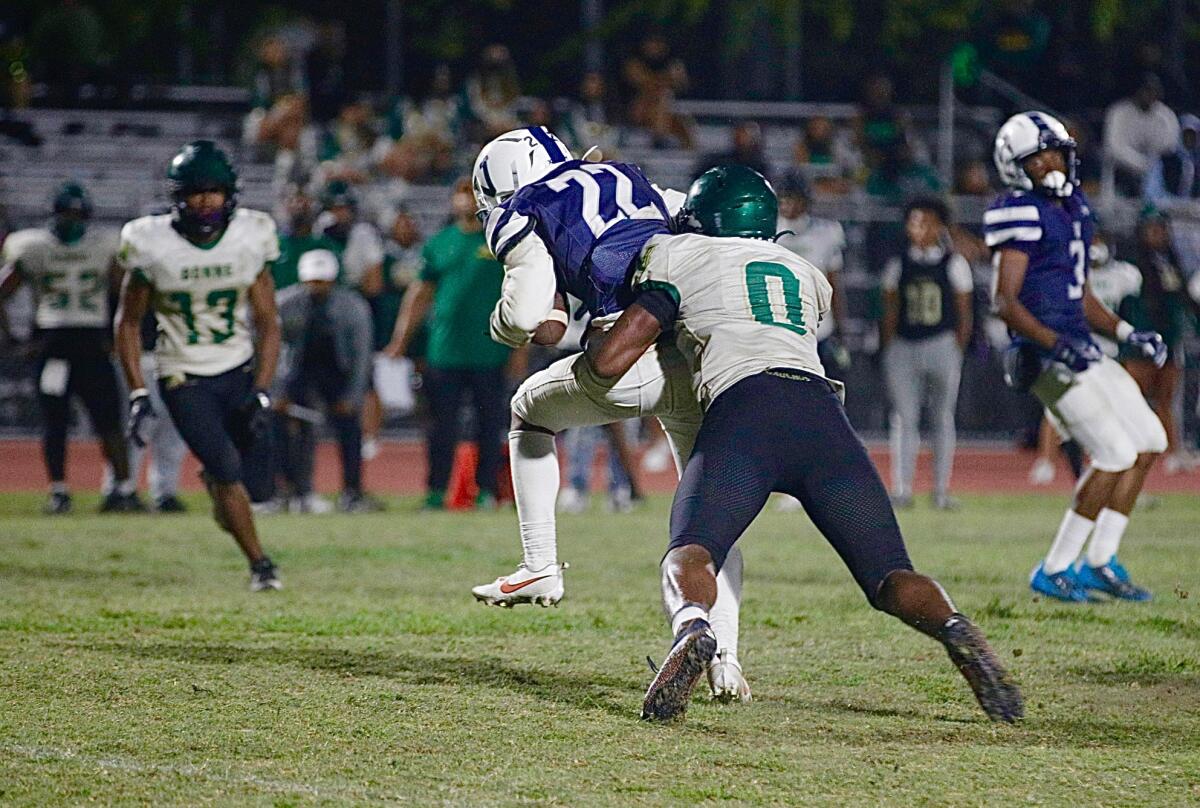 Narbonne linebacker Mark Iheanachor tackles Venice wide receiver Ryan Watson in the fourth quarter Thursday.