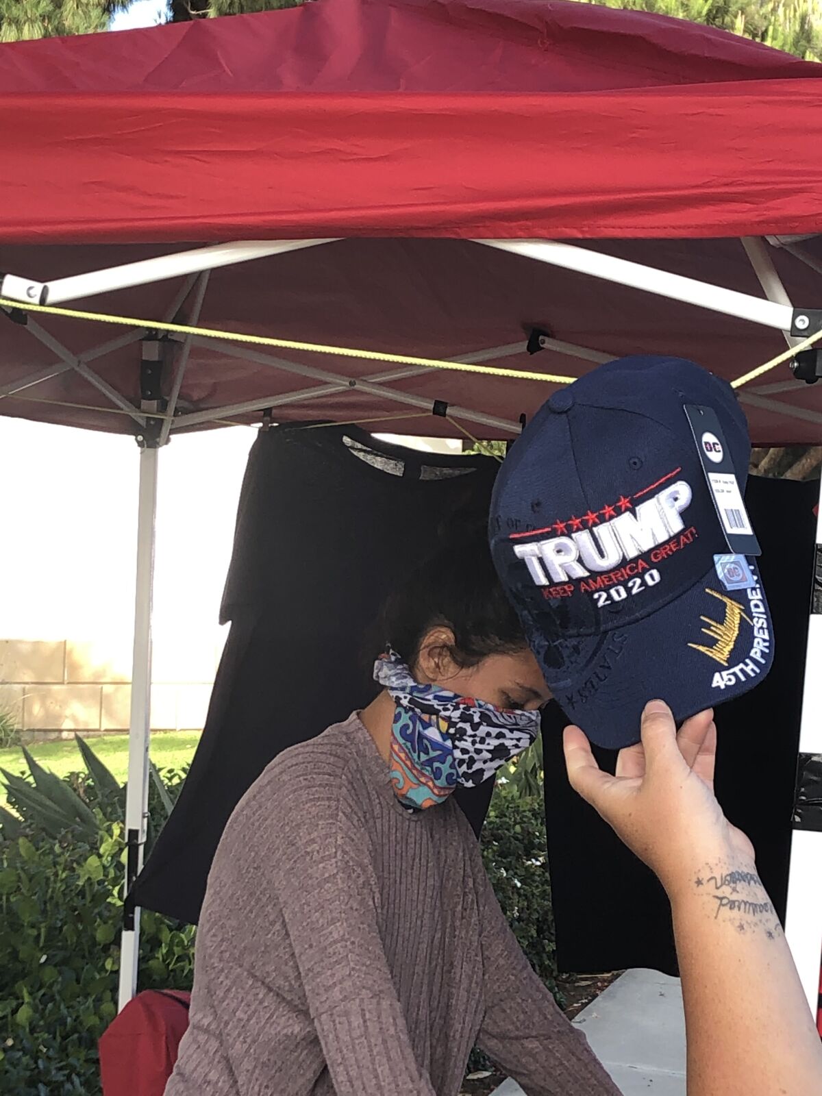 A Trump merchandise vendor seen at Torrey Pines Road and La Jolla Shores Drive in June.