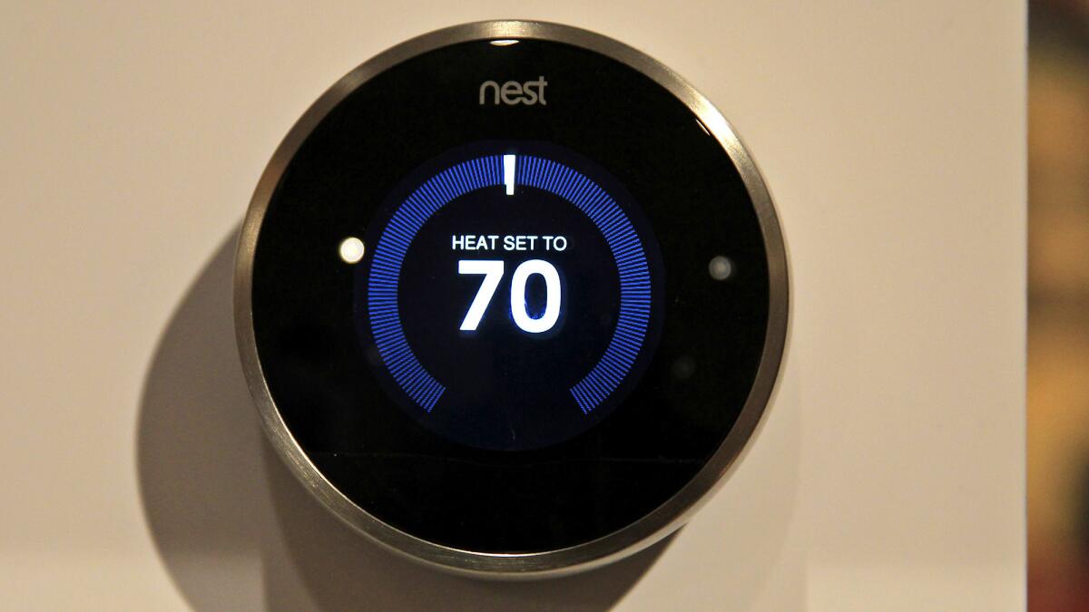 The Nest Learning Thermostat, which programs itself and can be controlled with a phone, is displayed at the Digital Experience portion of the 2015 CES at the Mirage Hotel in Las Vegas on Monday.