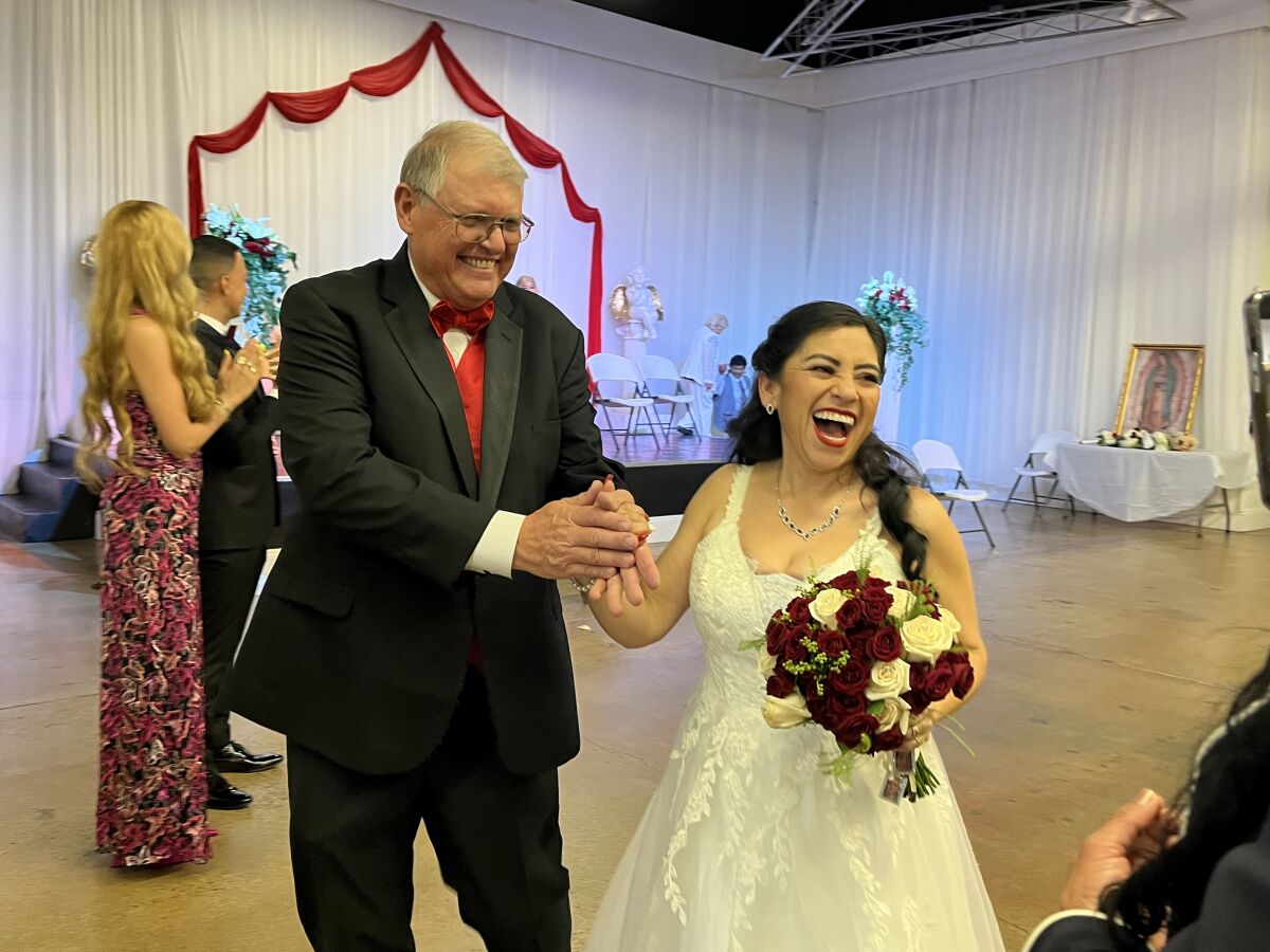 Thomas Schamber and Magda Sellon-Schamber at Anaheim Marketplace’s community wedding event.