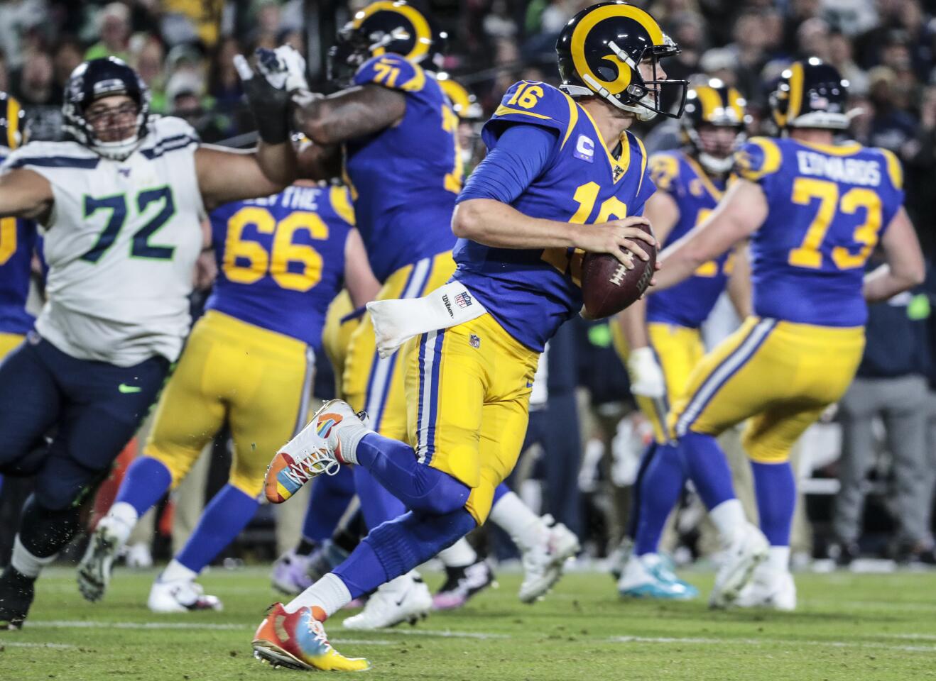 Rams quarterback Jared Goff scrambles for a short gain against the Seattle Seahawks.