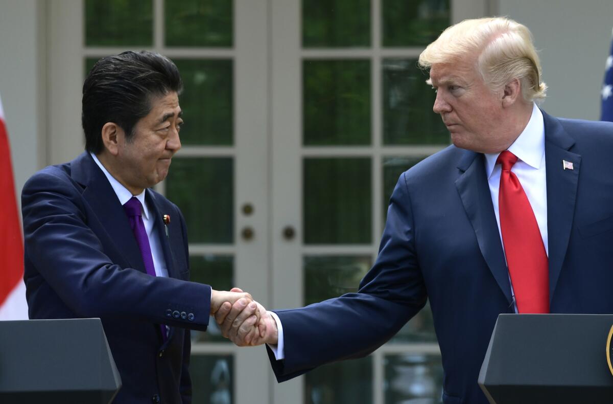 President Trump met Japan's Prime Minister Shinzo Abe on Thursday before the weekend Group of 7 summit, which Trump now plans to skip early.