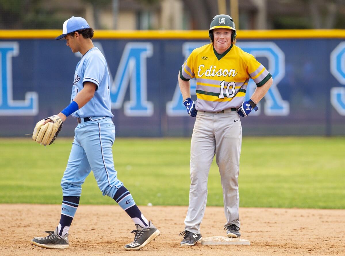 Edison High's Blake Morton looks to the bench after doubling in the fifth inning of a Sunset Conference crossover game at Corona del Mar on Friday.