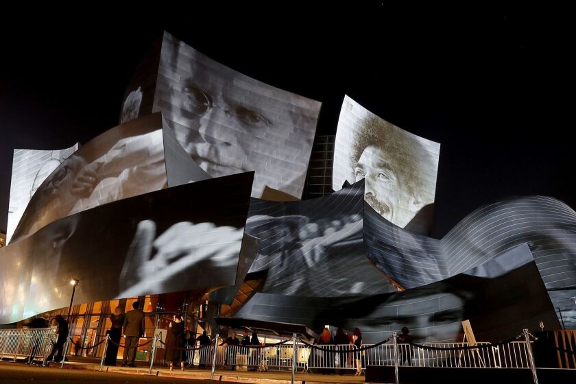 LOS ANGELES, CALIF. - SEP. 28, 2018. Artwork by Refik Anadol is projected on the exterior of the Walt Disney Concert Hall during the kickoff of the L.A. Phil's centennial on Thursday, Sept. 28, 2018. (Luis Sinco/Los Angeles Times)