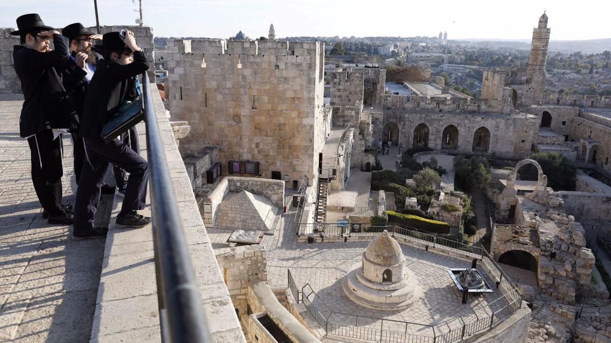 Orthodox Jews look at the Tower of David Museum in the Old City of Jerusalem on Nov. 30.