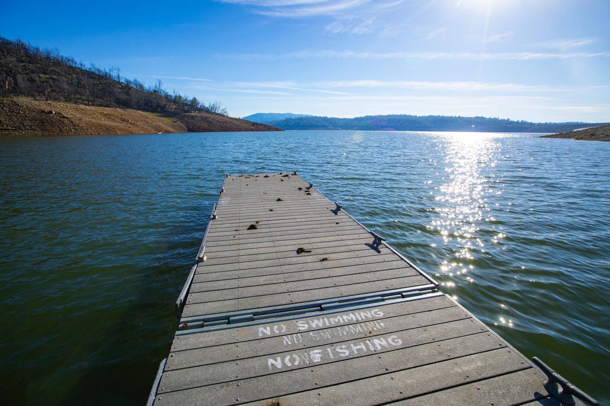 Feb. 2023 image of a boat dock at the Spillway Launch Ramp at Lake Oroville. The reservoir is currently 94% full.