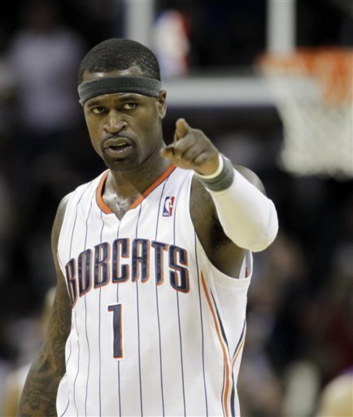 FILE - In this March 26, 2011, file photo, Charlotte Bobcats' Stephen Jackson points to the crowd in the final seconds of an NBA basketball game against the New York Knicks in Charlotte, N.C. The Bobcats have agreed to send Jackson to the Milwaukee Bucks in a three-team trade, a person familiar with the deal told The Associated Press on Thursday, June 23, 2011 on condition of anonymity. (AP Photo/Chuck Burton, File)