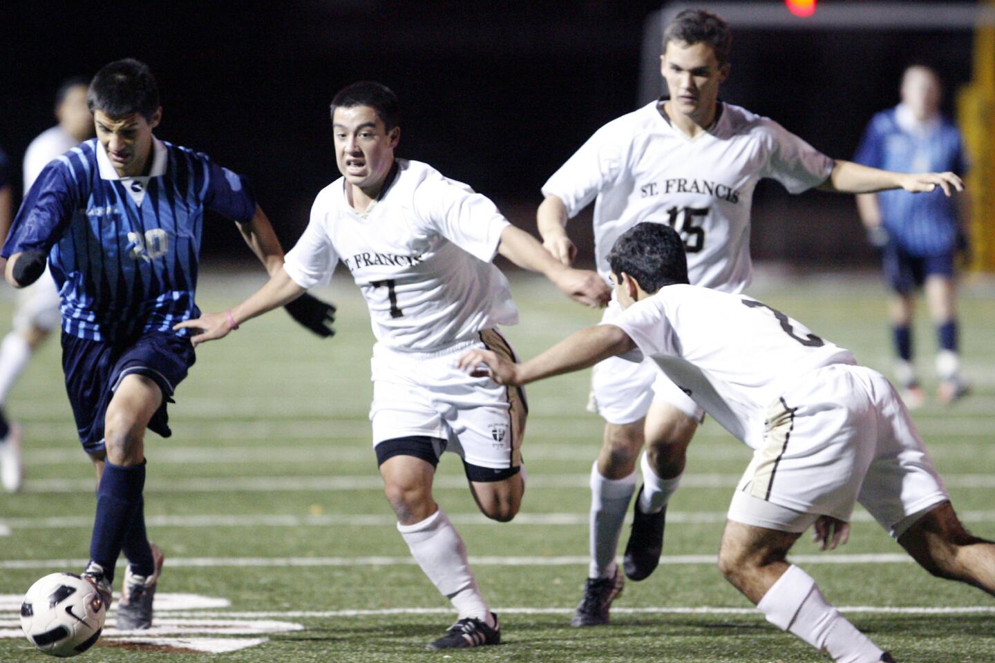 CV's Erick Trejo, from far left, and St. Francis' Derek Bell, fight for the ball during a game at St. Francis High School in La Canada on Saturday, December 3, 2011.