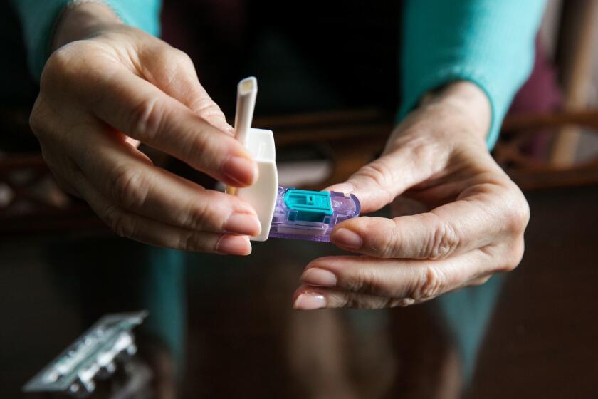 LOS ANGELES, CALIF. -- THURSDAY, MAY 14, 2015: Cynthia Goldstein, and her new inhalable insulin drug called Afrezza, to treat her diabetes, which she demonstrates for the camera how to inhale before a meal, in Los Angeles, Calif., on May 14, 2015. (Marcus Yam / Los Angeles Times)