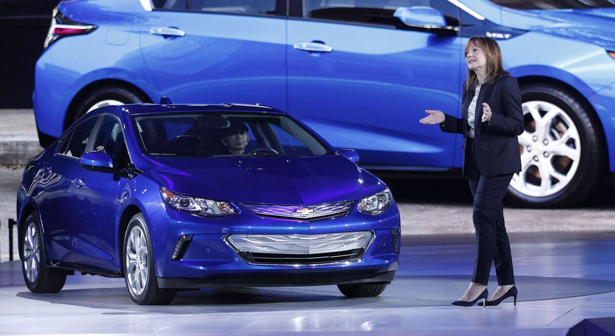 General Motors CEO Mary Barra reveals the new 2016 Chevrolet Volt to the media at the 2015 North American International Auto Show on Jan. 12 in Detroit.