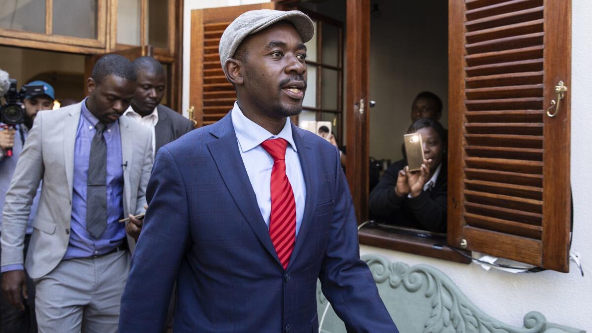 Opposition leader Nelson Chamisa arrives to talk to the press on Friday.