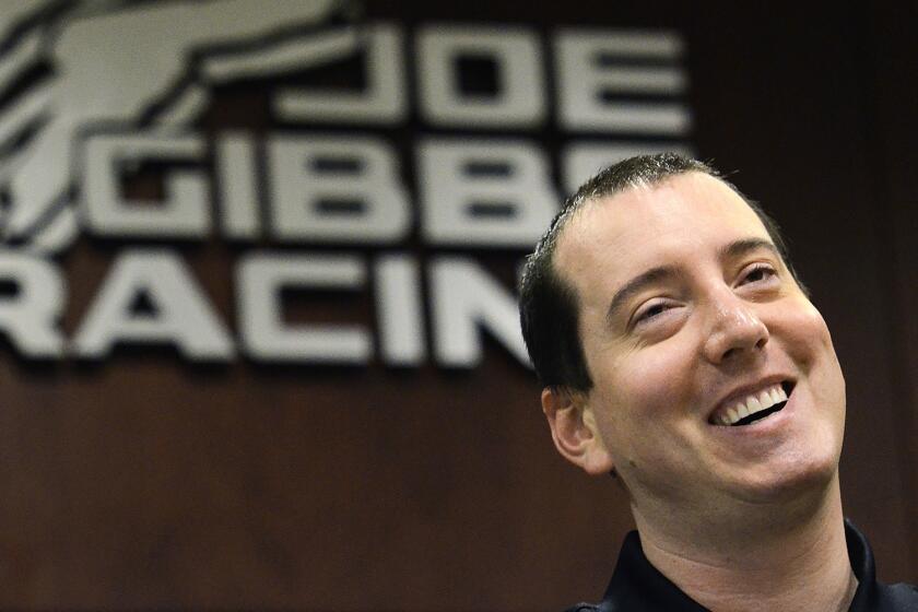 Kyle Busch smiles during a news conference at Daytona International Speedway on April 15.