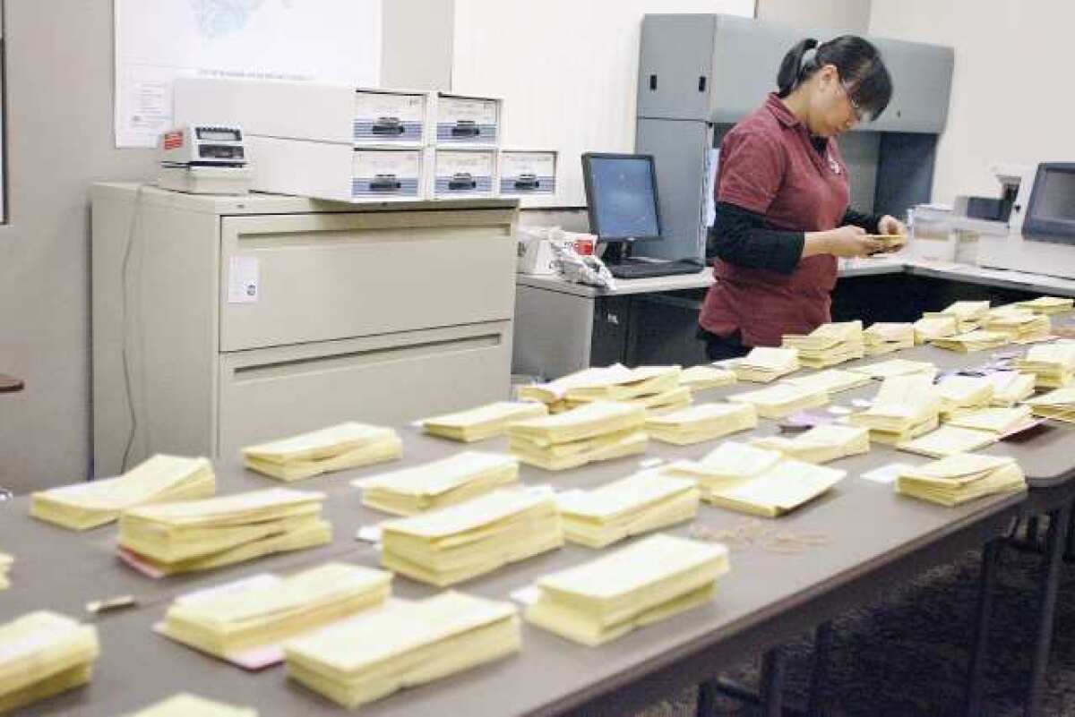 Jocyln Santos sorts out ballots during primary elections, which took place at Burbank City Hall on Tuesday, February 27, 2013.