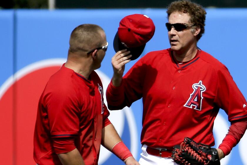 Actor Will Ferrell, right, replaces Angels center fielder Mike Trout during a spring training game against the Chicago Cubs on Thursday in Tempe, Ariz.