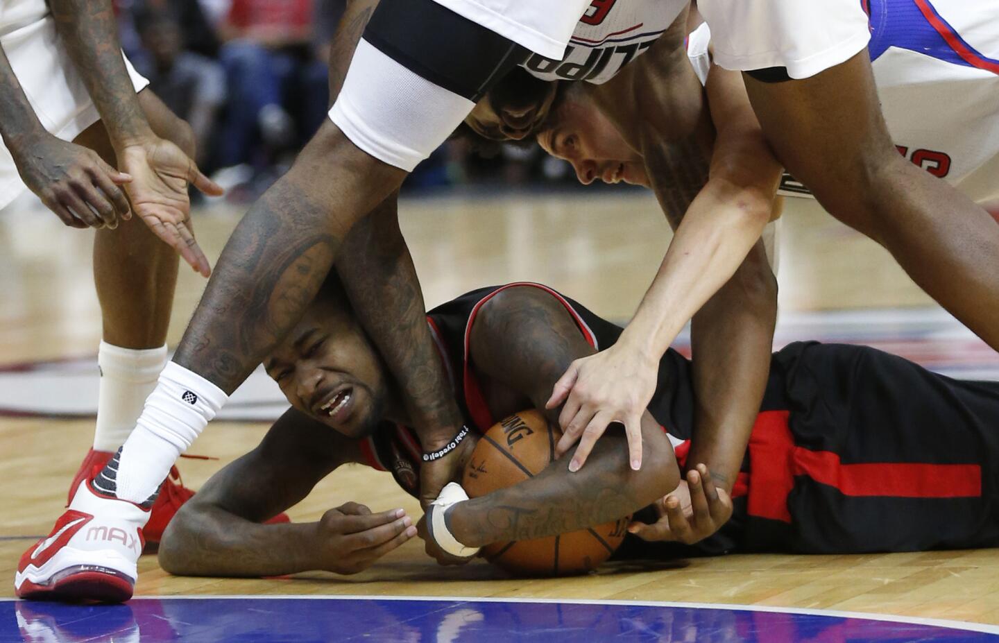 Raptors forward James Johnson is tied up by Clippers center DeAndre Jordan for a jump ball during the second half.