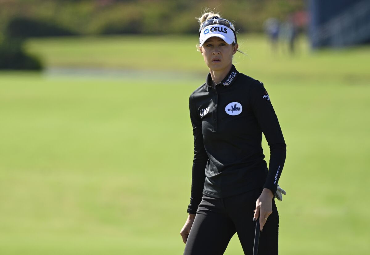 Nelly Korda walks to the first green during the final round of the LPGA Pelican Women's Championship golf tournament at Pelican Golf Club, Sunday, Nov. 14, 2021, in Belleair, Fla. (AP Photo/Steve Nesius)