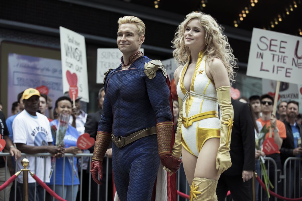 Anthony Starr as Homelander and Erin Moriarty as Starlight in "The Boys."