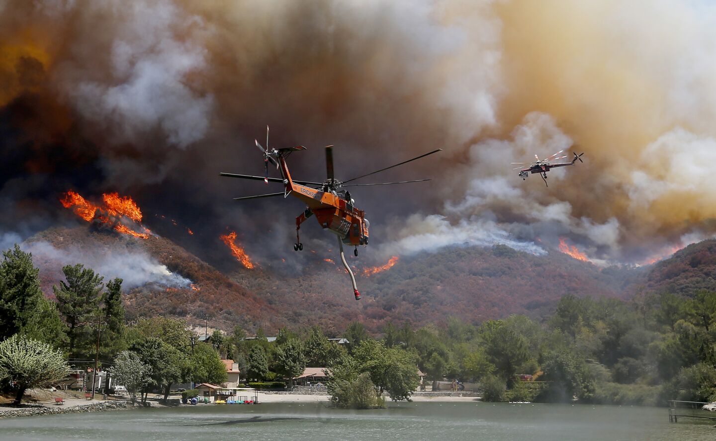 Firefighting helicopters battle the Blue Cut fire as it burns out of control around the community of Lytle Creek.