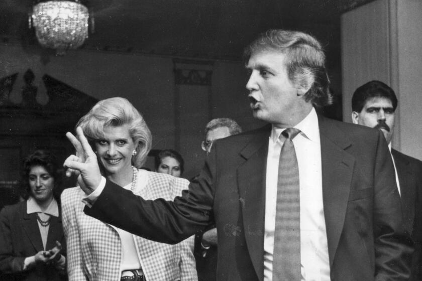 Donald Trump leaves a news conference with wife Ivana on Jan. 13, 1990, after announcing that he had purchased an interest in the Ambassador Hotel in Los Angeles.