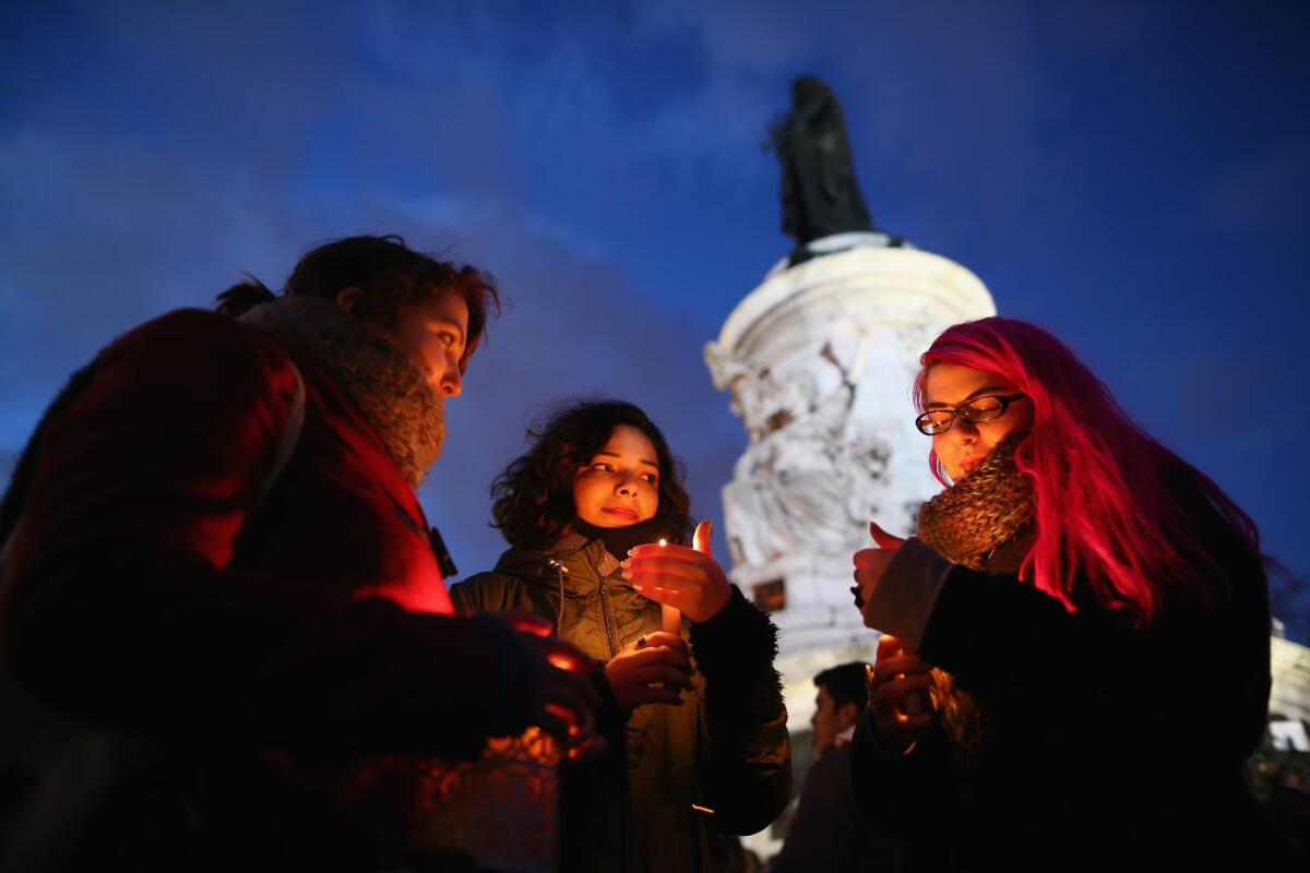 Many gathered for a vigil at Paris' Place de la Republique on Jan. 8 for victims of the Jan. 7 terrorist attack.