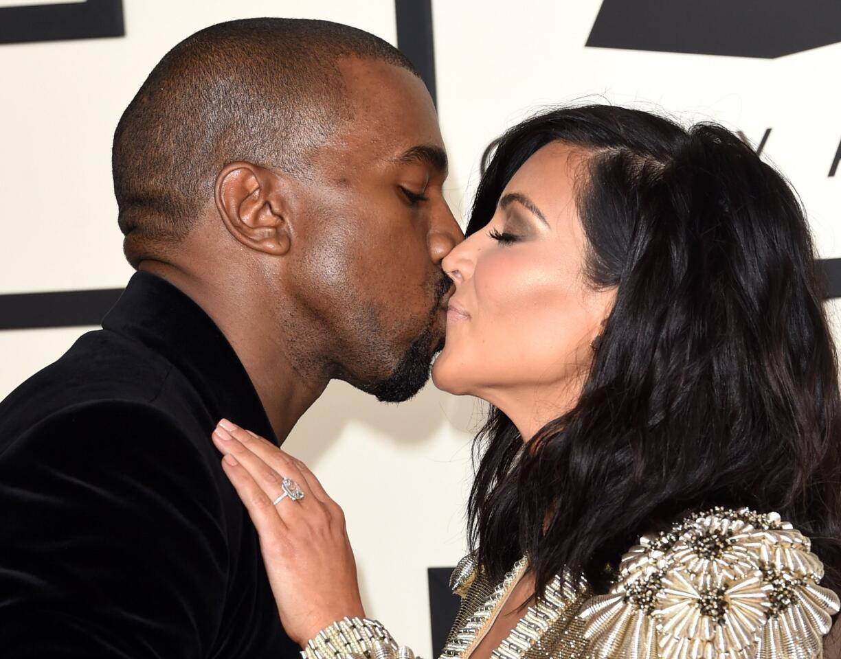 Kanye West shares a moment with wife Kim Kardashian on the red carpet at the 2015 Grammys. MORE: Show updates | Show highlights | Quotes | Red carpet