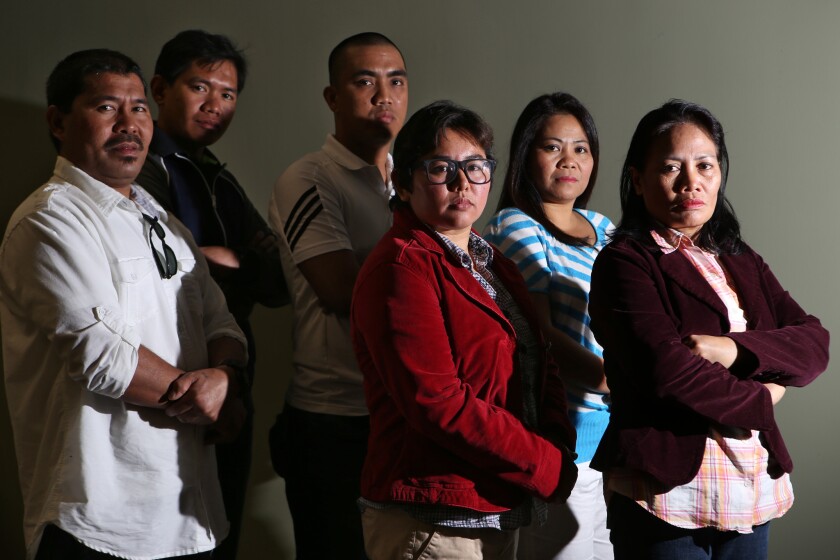 Eleven Filipino bakery workers who have sued L'Amande French Bakery alleging labor exploitation include, from left, Fernan Belidhon, Elmer Genito, Romar Cunanan, Louise Luis, Gina Pablo and Ermita Alabado.