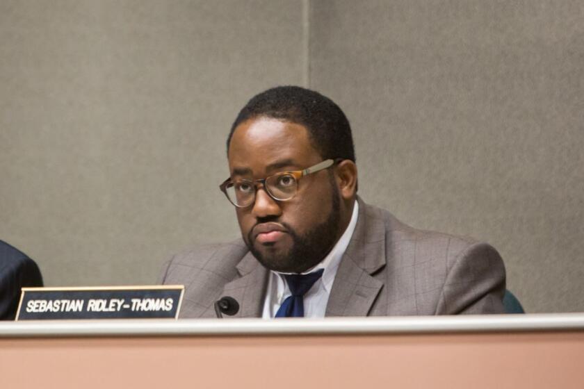 SACRAMENTO, CALIF. -- TUESDAY, JULY 7, 2015: Assemblymember Sebastian Ridley-Thomas, right, attends a hearing at the Statehouse Capitol, in Sacramento, Calif., on July 7, 2015. (Marcus Yam / Los Angeles Times)