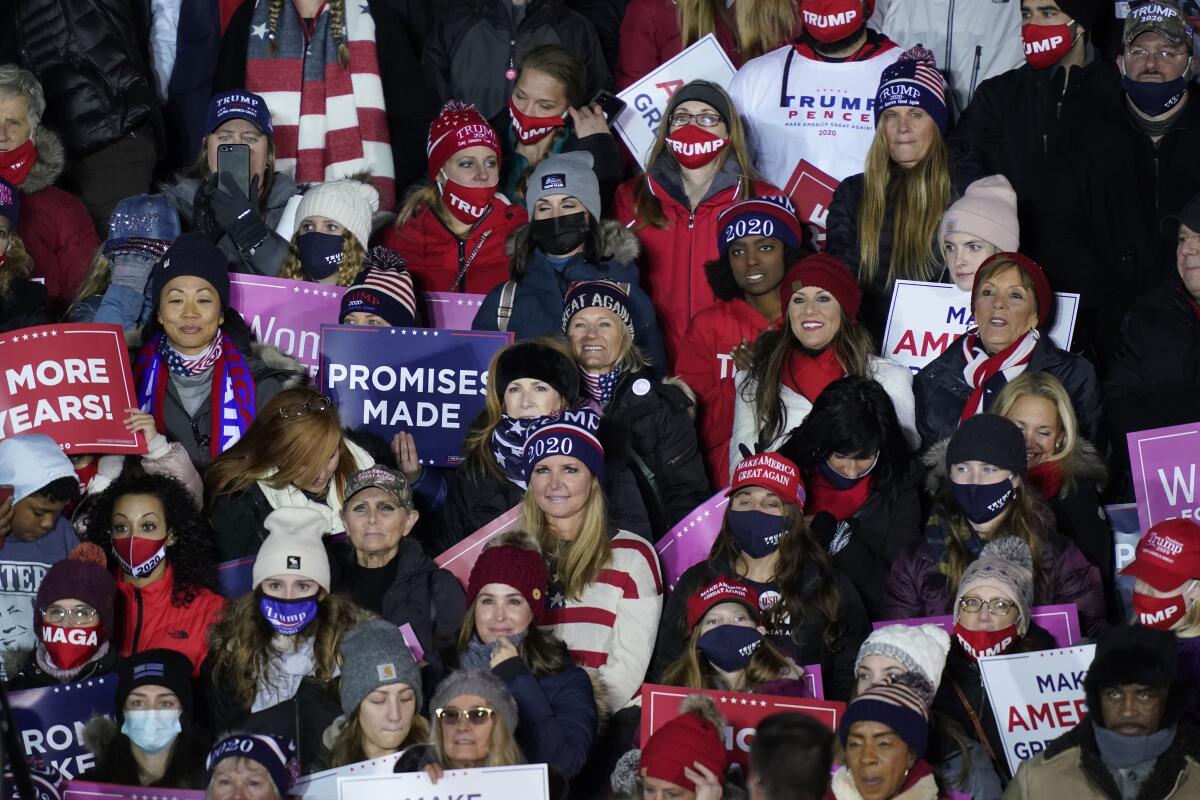 Supporters cheer at a campaign rally for President Trump in Grand Rapids, Mich. 