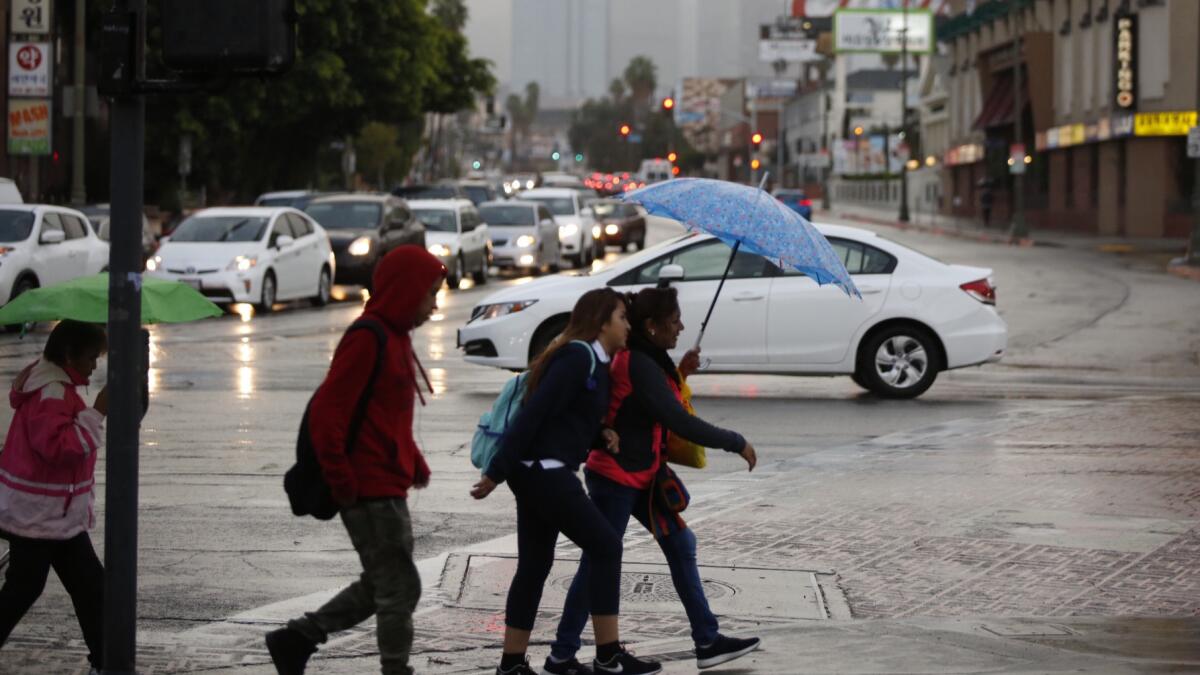 Rain dampened the Southland on Monday morning at Vermont and Olympic near downtown Los Angeles.