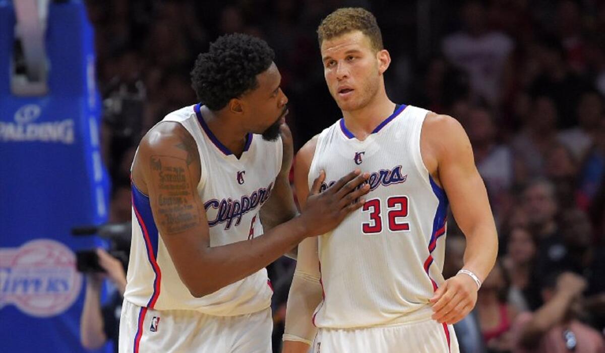 Clippers center DeAndre Jordan talks with forward Blake Griffin (32) during the second half of a playoff game against the Spurs.