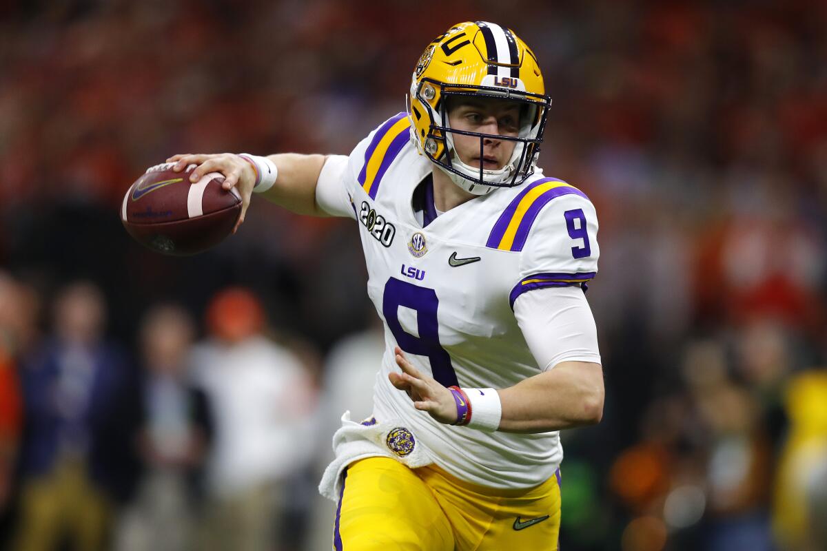 LSU quarterback Joe Burrow throws the ball under pressure against Clemson during the College Football Playoff National Championship game on Jan. 13 in New Orleans.