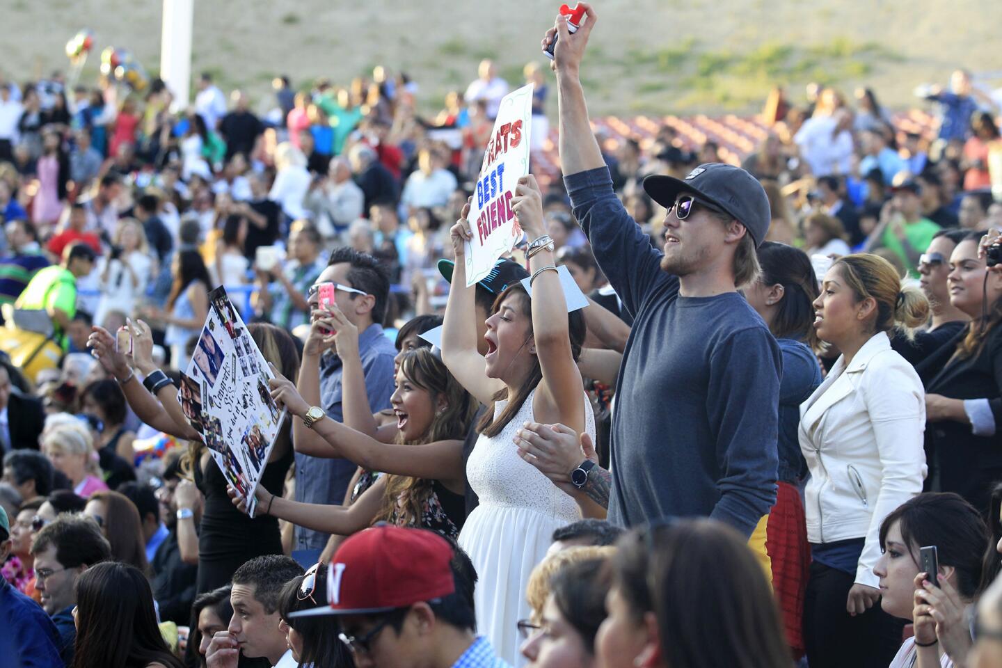 Family and friends voice their support during Orange Coast College's 66th Commencement Ceremony on Wednesday at Pacific Amphitheatre in Costa Mesa. (Kevin Chang/ Daily Pilot)