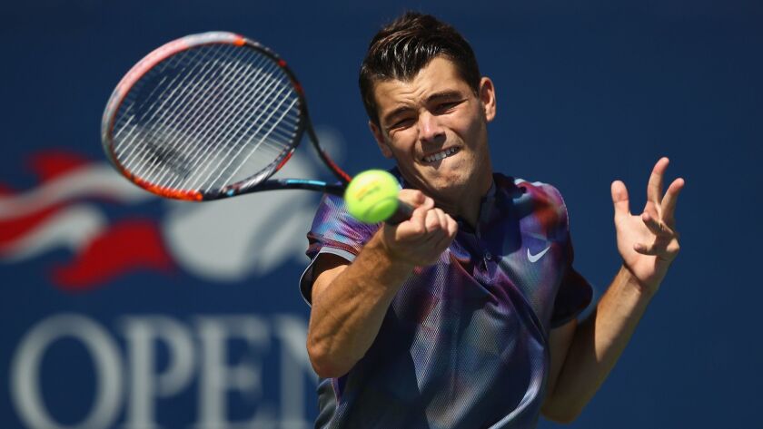 Taylor Fritz returns a shot during the 2017 U.S. Open.