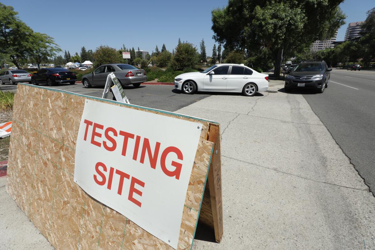 Drivers enter the Warner Center COVID-19 testing location on Monday, July 20, 2020 in Woodland Hills. 