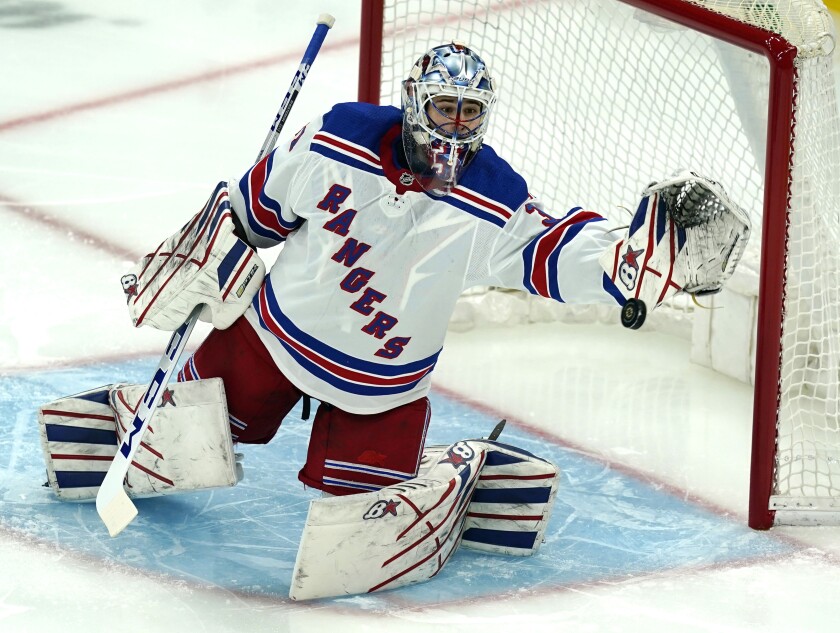 FILE - In this May 6, 2021, file photo, New York Rangers goaltender Igor Shesterkin watches the puck go wide in the first period of an NHL hockey game against the Boston Bruins in Boston. The Rangers secured their goaltending future by agreeing to re-sign Shesterkin to a four-year contract on Monday, Aug. 9, 2021. (AP Photo/Elise Amendola, File)