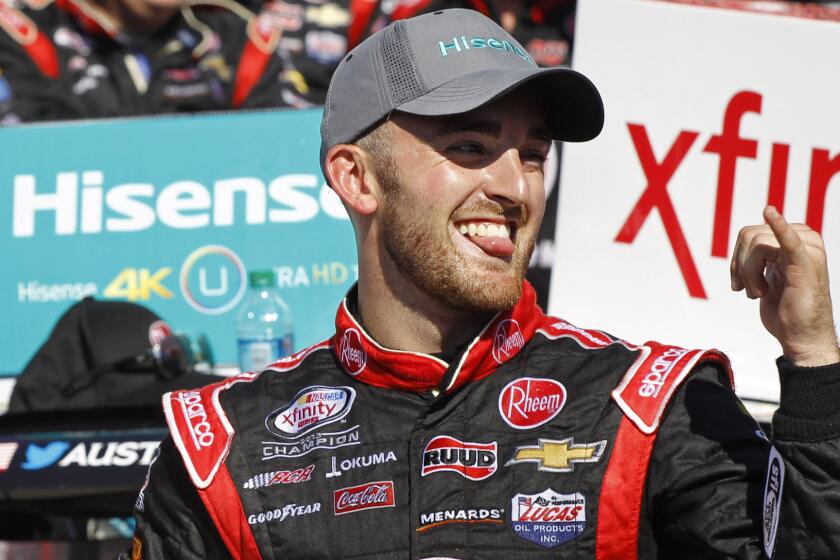 Austin Dillon celebrates after winning Saturday's NASCAR Xfinity Series race at Charlotte Motor Speedway.