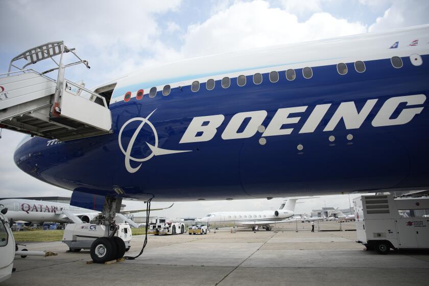 FILE - The Boeing 777X airplane is shown at the Paris Air Show in Le Bourget, north of Paris, France, on June 19, 2023. Boeing said Wednesday, July 31, 2024, that aerospace industry veteran Robert "Kelly" Ortberg will take over as CEO next week, replacing David Calhoun. Boeing is announcing the new CEO as it reports a loss of more than $1.4 billion in the second quarter. (AP Photo/Lewis Joly, File)