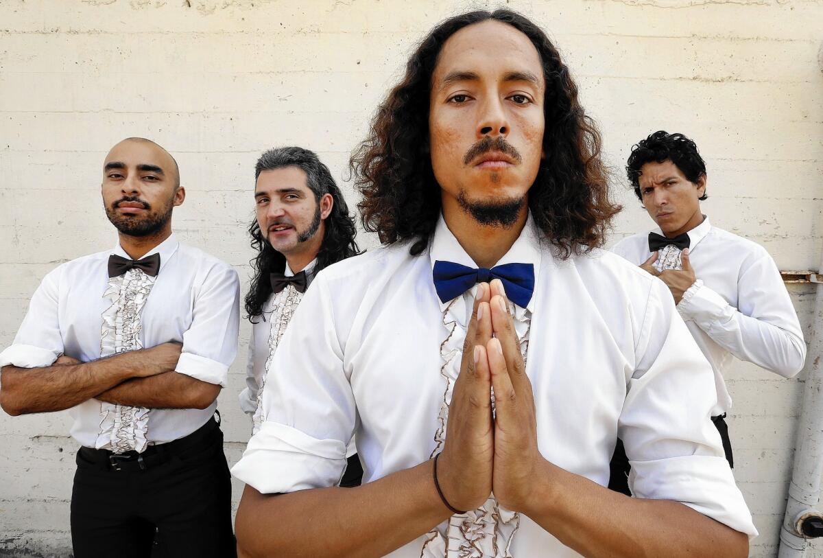 Chicano Batman members Carlos Arevalo, left, Gabriel Villa, Bardo Martinez and Eduardo Arenas in Los Angeles on Aug. 18, 2015.