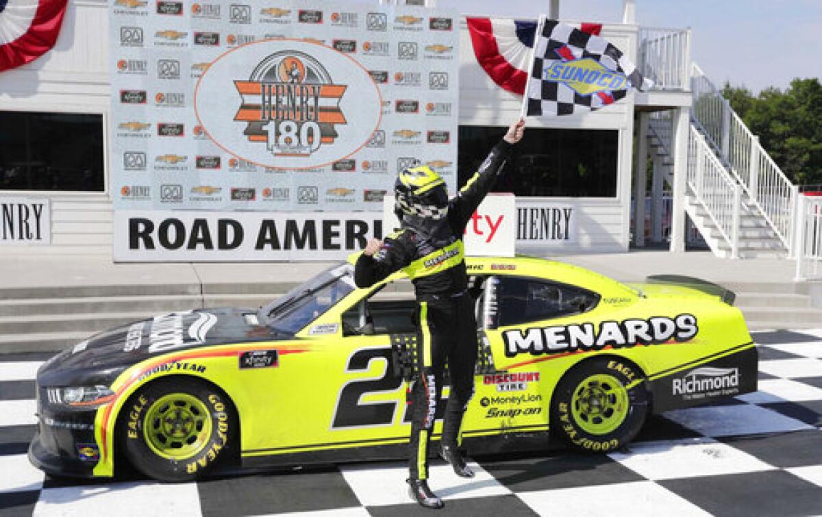 FILE - Austin Cindric reacts in Victory Lane after winning a NASCAR Xfinity Series auto race at Road America in Elkhart, Wisc., in this Saturday, Aug. 8, 2020, file photo. Road America owns a reputation as one of the nation’s foremost road courses, but it hasn’t hosted a NASCAR Cup Series event since the 1950s. That changes Sunday on the Fourth of July. (Gary C. Klein/The Sheboygan Press via AP, File)