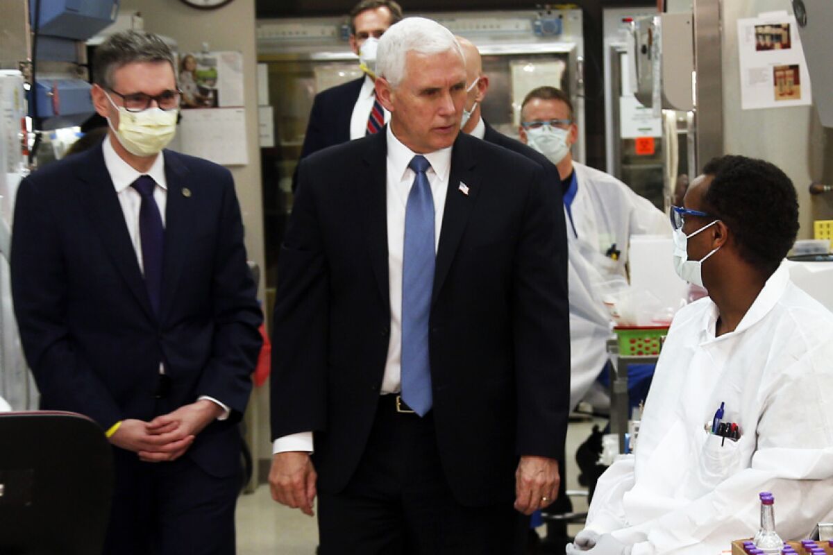 A maskless Vice President Mike Pence visits the Mayo Clinic.