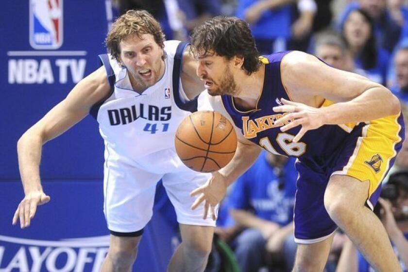 Lakers' Pau Gasol fumbles the ball against Mavericks' Dirk Nowitzki on May 6, 2011.