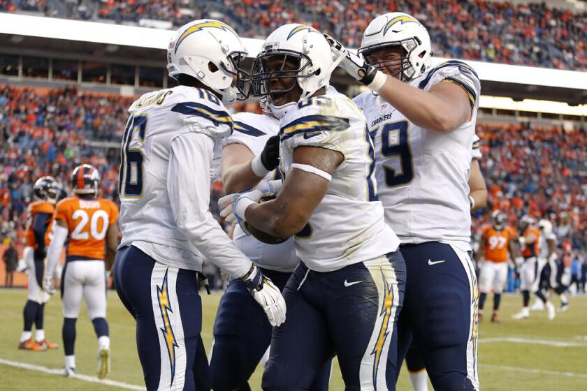 San Diego Chargers tight end Antonio Gates (85) celebrates a touchdown with teammates during the second half against the Denver Broncos on Jan. 3.