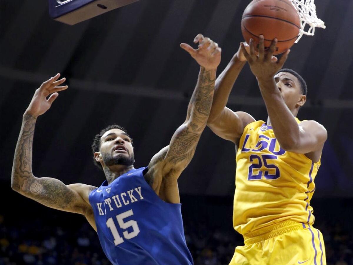 Kentucky's Willie Cauley-Stein battles underneath the hoop with LSU's Jordan Mickey during a game Tuesday in Baton Rouge, La. The Wildcats beat the Tigers, 71-69.