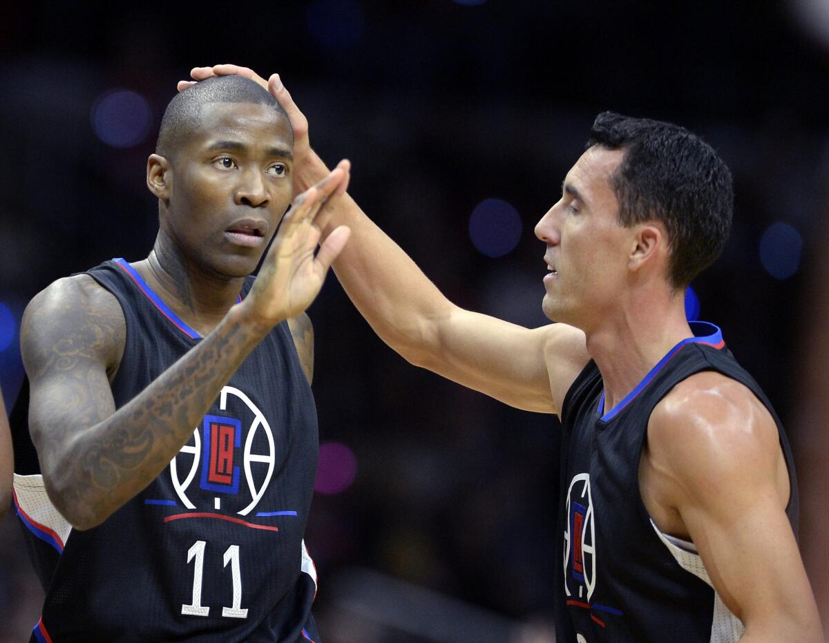 Clippers guard Jamal Crawford is congratulated by teammate Pablo Prigioni, right, during the first half of a game against the Orlando Magic on Dec. 5.