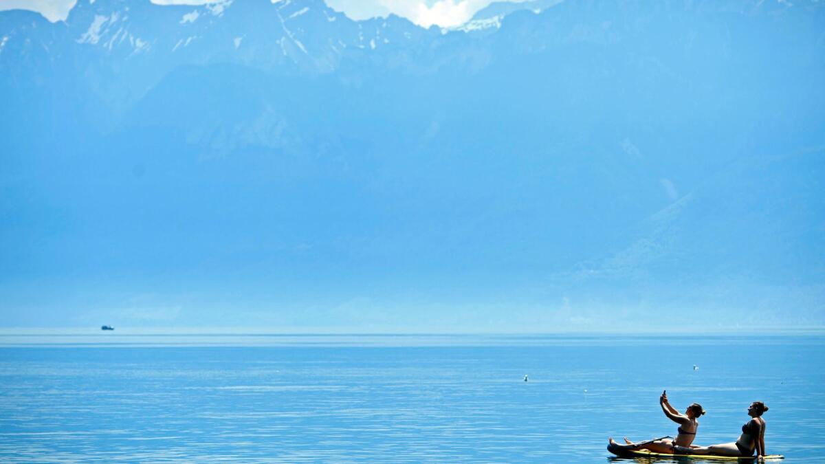 The study measured vacation photos, such as this one being taken in Switzerland, that were posted to Instagram.