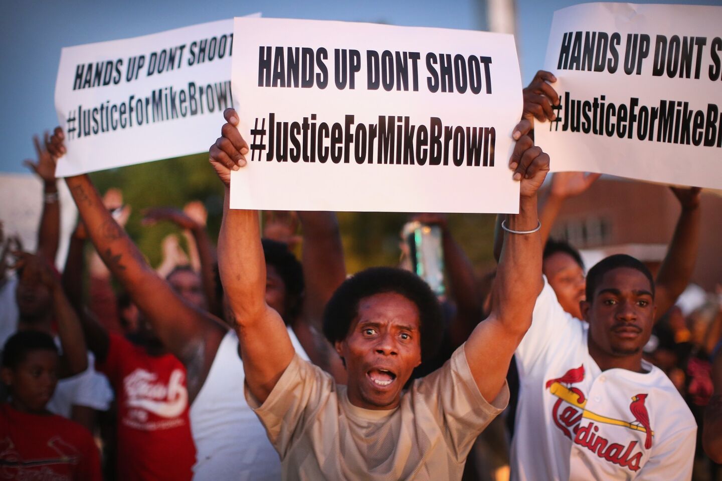 Demonstrators protesting the killing of Michael Brown rally in St. Louis.